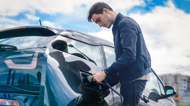 A man who charges his electric car